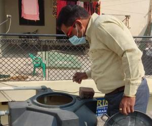 A health official inspecting a water tank in Ambala on Friday(HT Photo) A health official inspecting a water tank in Ambala on Friday(HT Photo)