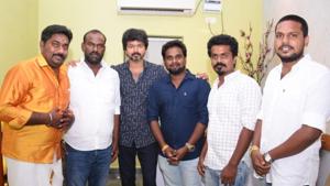 Vijay poses with his fans. Vijay poses with his fans.