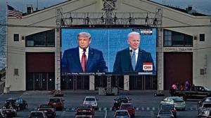People watch the final presidential debate between Donald Trump and Joe Biden on a giant screen from their vehicles at Fort Mason Center in San Francisco, US. People watch the final presidential debate between Donald Trump and Joe Biden on a giant screen from their vehicles at Fort Mason Center in San Francisco, US.