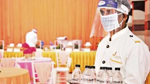 A server in PPE gear. Celebrations are making a comeback and bookings are trickling in, but weddings will continue to look different well into 2021.(Photo courtesy Megha Israni) A server in PPE gear. Celebrations are making a comeback and bookings are trickling in, but weddings will continue to look different well into 2021.(Photo courtesy Megha Israni)