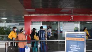 Travellers queue while maintaining social distancing at an entry gate at Terminal T2 of Indira Gandhi International (IGI) Airport which resumes operations from today in New Delhi.(Vipin Kumar/HT PHOTO) Travellers queue while maintaining social distancing at an entry gate at Terminal T2 of Indira Gandhi International (IGI) Airport which resumes operations from today in New Delhi.(Vipin Kumar/HT PHOTO)