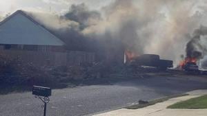 A US Navy training plane crashed in an Alabama residential neighbourhood near the Gulf Coast on Friday.(AP) A US Navy training plane crashed in an Alabama residential neighbourhood near the Gulf Coast on Friday.(AP)