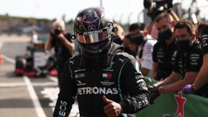 Formula One F1 - Portuguese Grand Prix - Algarve International Circuit, Portimao, Portugal - October 24, 2020 Mercedes' Lewis Hamilton celebrates after qualifying in pole position Pool via REUTERS/Jose Sena Goulao(Pool via REUTERS) Formula One F1 - Portuguese Grand Prix - Algarve International Circuit, Portimao, Portugal - October 24, 2020 Mercedes' Lewis Hamilton celebrates after qualifying in pole position Pool via REUTERS/Jose Sena Goulao(Pool via REUTERS)