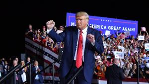 TOPSHOT - US President Donald Trump dances at the end of a campaign rally at Pensacola International Airport in Pensacola, Florida on October 23, 2020.(AFP) TOPSHOT - US President Donald Trump dances at the end of a campaign rally at Pensacola International Airport in Pensacola, Florida on October 23, 2020.(AFP)