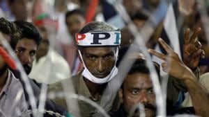 FATF’s decision to keep Pakistan in grey list comes at a time when anti government protests are gaining momentum in the country. In picture - People at a protest rally in Karachi.(Reuters photo) FATF’s decision to keep Pakistan in grey list comes at a time when anti government protests are gaining momentum in the country. In picture - People at a protest rally in Karachi.(Reuters photo)