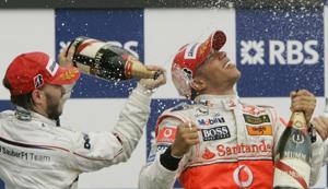 FILE - In this Sunday, June 10, 2007 file photo, Sauber driver Nick Heidfeld, left, of Germany, and McLaren Mercedes driver Lewis Hamilton, right, of Britain, celebrate after Hamilton won the Canadian Grand Prix Formula One race at the Circuit Gilles Villeneuve in Montreal, Canada. British driver Lewis Hamilton made Formula One history on Sunday, Oct. 25, 2020 winning the Portuguese Grand Prix for a 92nd win to move one ahead of German great Michael Schumacher. (AP Photo/Darron Cummings, file)(AP) FILE - In this Sunday, June 10, 2007 file photo, Sauber driver Nick Heidfeld, left, of Germany, and McLaren Mercedes driver Lewis Hamilton, right, of Britain, celebrate after Hamilton won the Canadian Grand Prix Formula One race at the Circuit Gilles Villeneuve in Montreal, Canada. British driver Lewis Hamilton made Formula One history on Sunday, Oct. 25, 2020 winning the Portuguese Grand Prix for a 92nd win to move one ahead of German great Michael Schumacher. (AP Photo/Darron Cummings, file)(AP)