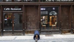 A beggar kneels in front of a closed restaurant in downtown Prague, Czech Republic. The coronavirus pandemic is gathering strength again in Europe and, with winter coming, its restaurant industry is struggling.(AP) A beggar kneels in front of a closed restaurant in downtown Prague, Czech Republic. The coronavirus pandemic is gathering strength again in Europe and, with winter coming, its restaurant industry is struggling.(AP)