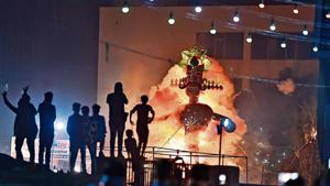 An effigy of Ravana in flames during one of the permitted celebrations in Karkardooma on Sunday. An effigy of Ravana in flames during one of the permitted celebrations in Karkardooma on Sunday.