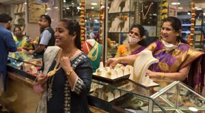A woman checks out a gold necklace at a jewellery store in Mumbai on Dussehra on Sunday.(Satish Bate/HT Photo) A woman checks out a gold necklace at a jewellery store in Mumbai on Dussehra on Sunday.(Satish Bate/HT Photo)