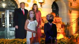 President Donald Trump and first lady Melania Trump poses for a photo with children dressed as them.(AP) President Donald Trump and first lady Melania Trump poses for a photo with children dressed as them.(AP)