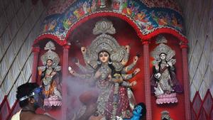 A local puja committee is only the one that will keep up with the tradition in the river, which forms a natural boundary between the two countries.(Representational Photo/AFP) A local puja committee is only the one that will keep up with the tradition in the river, which forms a natural boundary between the two countries.(Representational Photo/AFP)