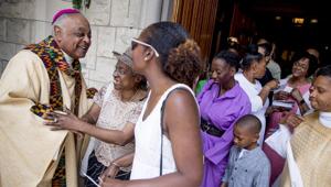 In this photo, Washington DC Archbishop Wilton Gregory greets parishioners following Mass at St. Augustine Church in Washington.(AP) In this photo, Washington DC Archbishop Wilton Gregory greets parishioners following Mass at St. Augustine Church in Washington.(AP)