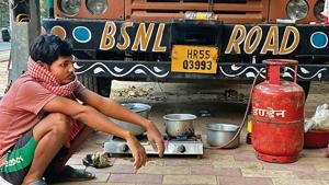 Mr Kumar is sitting on his haunches, in the middle of all this equipment, wearing a t-shirt and shorts.(Mayank Austen Soofi) Mr Kumar is sitting on his haunches, in the middle of all this equipment, wearing a t-shirt and shorts.(Mayank Austen Soofi)