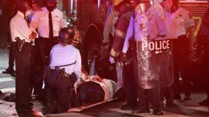 A police officer lies on the ground before being loaded into an ambulance on 52nd Street in West Philadelphia in the early hours of Tuesday.(AP) A police officer lies on the ground before being loaded into an ambulance on 52nd Street in West Philadelphia in the early hours of Tuesday.(AP)