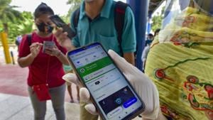 A commuter shows her COVID-19 status via Aarogya Setu app before entering Vaishali station on September 9.(PTI) A commuter shows her COVID-19 status via Aarogya Setu app before entering Vaishali station on September 9.(PTI)