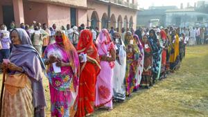 Voters stand in queues at a polling booth to cast their votes for the first phase of Bihar Assembly Election.(PTI)
