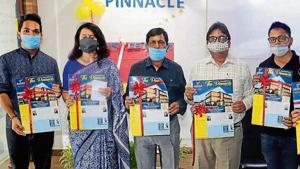Students and faculty members of Alliance International School during the release of the school newsletter on Wednesday.(HT) Students and faculty members of Alliance International School during the release of the school newsletter on Wednesday.(HT)