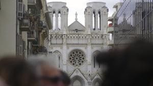 People and journalist stand near the scene of the knife attack at the Notre Dame church, in Nice, France, Thursday, Oct. 29, 2020. An attacker armed with a knife killed three people at a church in the Mediterranean city of Nice, the third attack in two months in France.(AP) People and journalist stand near the scene of the knife attack at the Notre Dame church, in Nice, France, Thursday, Oct. 29, 2020. An attacker armed with a knife killed three people at a church in the Mediterranean city of Nice, the third attack in two months in France.(AP)