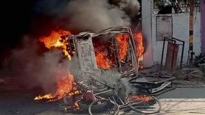 A vehicle set afire by an angry mob during a protest over the recent police firing during a Durga Puja event in Munger, Bihar, on Thursday.(PTI) A vehicle set afire by an angry mob during a protest over the recent police firing during a Durga Puja event in Munger, Bihar, on Thursday.(PTI)