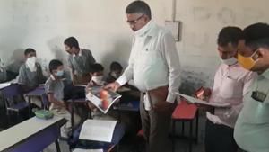 The students were sitting close to each other in violation of social distancing norms.(HT Photo) The students were sitting close to each other in violation of social distancing norms.(HT Photo)