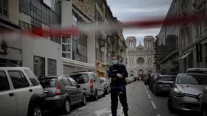 A French policeman stands guard near the scene of the knife attack at the Notre Dame church in Nice, France.(AP) A French policeman stands guard near the scene of the knife attack at the Notre Dame church in Nice, France.(AP)