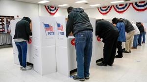 Voters stand at voting booths during early voting at the Oklahoma Election Board in Oklahoma City, Oklahoma, US.(REUTERS) Voters stand at voting booths during early voting at the Oklahoma Election Board in Oklahoma City, Oklahoma, US.(REUTERS)