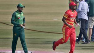Zimbabwe's skipper Chamu Chibhabha, in red, and his Pakistani counterpart Babar Azam, left, walk back after the toss for their 1st one-day international cricket match at the Pindi Cricket Stadium, in Rawalpindi, Pakistan.(AP) Zimbabwe's skipper Chamu Chibhabha, in red, and his Pakistani counterpart Babar Azam, left, walk back after the toss for their 1st one-day international cricket match at the Pindi Cricket Stadium, in Rawalpindi, Pakistan.(AP)