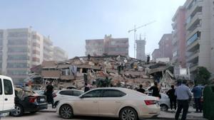 People work on a collapsed building, in Izmir, Turkey, Friday, Oct. 30, 2020, after a strong earthquake in the Aegean Sea has shaken Turkey and Greece. Turkey's Disaster and Emergency Management Presidency said Friday's earthquake was centered in the Aegean at a depth of 16.5 kilometers (10.3 miles) and registered at a 6.6 magnitude.(AP) People work on a collapsed building, in Izmir, Turkey, Friday, Oct. 30, 2020, after a strong earthquake in the Aegean Sea has shaken Turkey and Greece. Turkey's Disaster and Emergency Management Presidency said Friday's earthquake was centered in the Aegean at a depth of 16.5 kilometers (10.3 miles) and registered at a 6.6 magnitude.(AP)