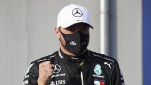 Formula One F1 - Emilia Romagna Grand Prix - Autodromo Enzo e Dino Ferrari, Imola, Italy - October 31, 2020 Mercedes' Valtteri Bottas celebrates after qualifying in pole position Pool via REUTERS/Luca Bruno(Pool via REUTERS) Formula One F1 - Emilia Romagna Grand Prix - Autodromo Enzo e Dino Ferrari, Imola, Italy - October 31, 2020 Mercedes' Valtteri Bottas celebrates after qualifying in pole position Pool via REUTERS/Luca Bruno(Pool via REUTERS)