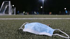 A used face mask is seen on the pitch during the last training session of a youth soccer team of a sports club before lockdown as the spread of the coronavirus disease (Covid-19) continues in Frankfurt, Germany on October 30, 2020.(Reuters Photo) A used face mask is seen on the pitch during the last training session of a youth soccer team of a sports club before lockdown as the spread of the coronavirus disease (Covid-19) continues in Frankfurt, Germany on October 30, 2020.(Reuters Photo)