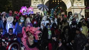 Revelers gather during the Greenwich Village Halloween Parade, Saturday, October 31, 2020, in New York. (AP Photo/Jeenah Moon) Revelers gather during the Greenwich Village Halloween Parade, Saturday, October 31, 2020, in New York. (AP Photo/Jeenah Moon)