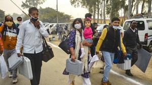 Polling officials carry EVMs and VVPATs as they leave for their station ahead of Uttar Pradesh bypolls, at Naugawan Sadat in Amroha district on Monday.(PTI Photo) Polling officials carry EVMs and VVPATs as they leave for their station ahead of Uttar Pradesh bypolls, at Naugawan Sadat in Amroha district on Monday.(PTI Photo)