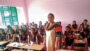 A teacher with her students at a government primary school in Prayagraj.(HT File) A teacher with her students at a government primary school in Prayagraj.(HT File)