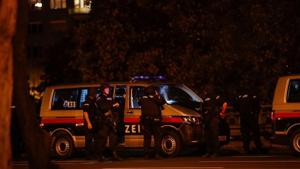 Police officers stand guard on a street after exchanges of gunfire in Vienna, Austria.(REUTERS) Police officers stand guard on a street after exchanges of gunfire in Vienna, Austria.(REUTERS)