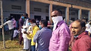 People stand in a queue as they arrive to cast their vote for bypoll in the Ghatampur assembly in Kanpur on Tuesday. (ANI Photo) People stand in a queue as they arrive to cast their vote for bypoll in the Ghatampur assembly in Kanpur on Tuesday. (ANI Photo)