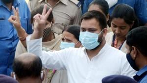 RJD leader Tejashwi Yadav flashes a victory sign after casting his vote fin the second phase of the Bihar Assembly Election in Patna on Tuesday.(ANI) RJD leader Tejashwi Yadav flashes a victory sign after casting his vote fin the second phase of the Bihar Assembly Election in Patna on Tuesday.(ANI)