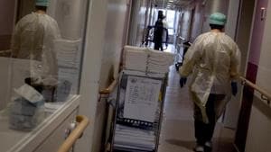 A healthcare supervisor walks down the hallway as she does her rounds in the Covid-19 ward of the CHC nursing home in Landenne, Belgium, Wednesday, Nov. 4, 2020.(AP photo) A healthcare supervisor walks down the hallway as she does her rounds in the Covid-19 ward of the CHC nursing home in Landenne, Belgium, Wednesday, Nov. 4, 2020.(AP photo)