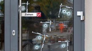 Bullet holes are seen at the door of a restaurant at one of the sites of a terrorist attack, in Vienna, Austria.(AFP) Bullet holes are seen at the door of a restaurant at one of the sites of a terrorist attack, in Vienna, Austria.(AFP)