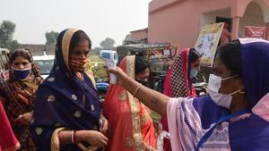 A voter getting their body temperature checked at a polling station before voting in the second phase of Bihar Assembly Elections, at Danapur Diyara, in Patna, Bihar, India, on Tuesday, Nov. 03, 2020 (Photo by Santosh Kumar/ Hindustan Times) A voter getting their body temperature checked at a polling station before voting in the second phase of Bihar Assembly Elections, at Danapur Diyara, in Patna, Bihar, India, on Tuesday, Nov. 03, 2020 (Photo by Santosh Kumar/ Hindustan Times)
