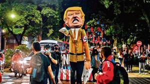 Protesters surround a dummy depicting United States President Donald Trump making a Nazi salute before burning it in Medellin, Colombia, on November 6, 2020, in the framework of the US election(Photo: AFP) Protesters surround a dummy depicting United States President Donald Trump making a Nazi salute before burning it in Medellin, Colombia, on November 6, 2020, in the framework of the US election(Photo: AFP)