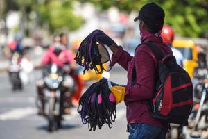 A vendor sells masks on a street during the Covid-19 lockdown in Chennai on June 15.(PTI FILE) A vendor sells masks on a street during the Covid-19 lockdown in Chennai on June 15.(PTI FILE)