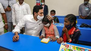 Andhra Pradesh Chief minister YS Jagan Mohan Reddy interacts with school students during the launch of Jagananna Vidya Kanuka scheme, at Punadipadu Zilla Parishad High School near Vijayawada.(PTI) Andhra Pradesh Chief minister YS Jagan Mohan Reddy interacts with school students during the launch of Jagananna Vidya Kanuka scheme, at Punadipadu Zilla Parishad High School near Vijayawada.(PTI)