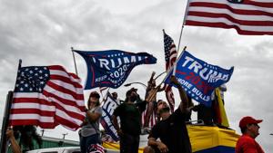 Supporters of US President Donald Trump hold signs and flags during a protest in Miami on November 7, 2020, after Joe Biden was declared the winner of the 2020 presidential election.(AFP) Supporters of US President Donald Trump hold signs and flags during a protest in Miami on November 7, 2020, after Joe Biden was declared the winner of the 2020 presidential election.(AFP)