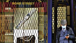 A man stands next to a closed retail store on New Bond Street amid the coronavirus disease (Covid-19) outbreak in London.(Reuters) A man stands next to a closed retail store on New Bond Street amid the coronavirus disease (Covid-19) outbreak in London.(Reuters)