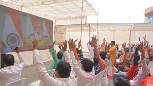People watching Prime Minister Narendra Modi’s address on a big screen at Dashashwamedh Ghat in Varanasi on Monday(HT PHOTO) People watching Prime Minister Narendra Modi’s address on a big screen at Dashashwamedh Ghat in Varanasi on Monday(HT PHOTO)