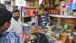 People look to buy firecrackers from a shop ahead of Diwali festival at Sadar bazar, in New Delhi on November 3, 2020.(Amal KS/HT Photo)