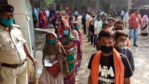 Voters stand in queues at the polling station to cast votes for the third phase of Bihar Assembly Election. The counting of the votes will be done today and the results will be announced.(ANI)