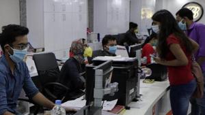 Bank employees and customers wear protective masks as a precaution against Covid-19 in Mumbai.(AP File Photo) Bank employees and customers wear protective masks as a precaution against Covid-19 in Mumbai.(AP File Photo)