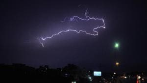 Lightning seen in the night sky during rain in Delhi.(ANI) Lightning seen in the night sky during rain in Delhi.(ANI)