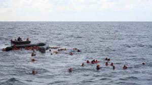Refugees and migrants are rescued by members of the Spanish NGO Proactiva Open Arms, after leaving Libya trying to reach European soil aboard an overcrowded rubber boat in the Mediterranean sea.(AP)